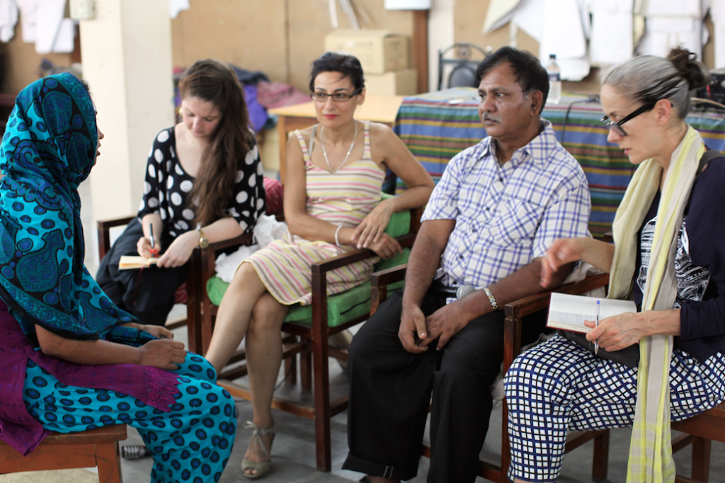 Caryn and Safia listening to workers talk about conditions in Dhaka factories